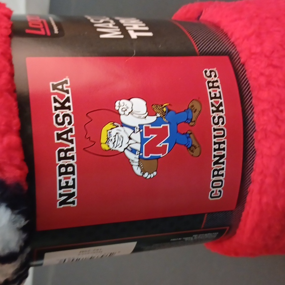NWT Nebraska cornhusker plush mascot throw. 50" x 60" lightweight warm fabric